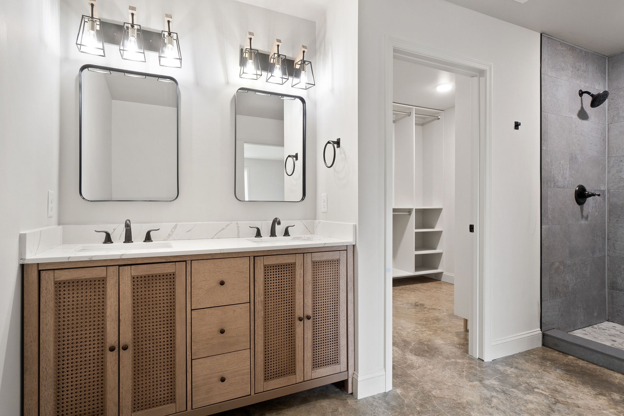 1124 Dale Ridge Road Dowelltown, TN 37059 - Photo 26 of 69 a bathroom with double vanity sinks a mirror and a glass door shower