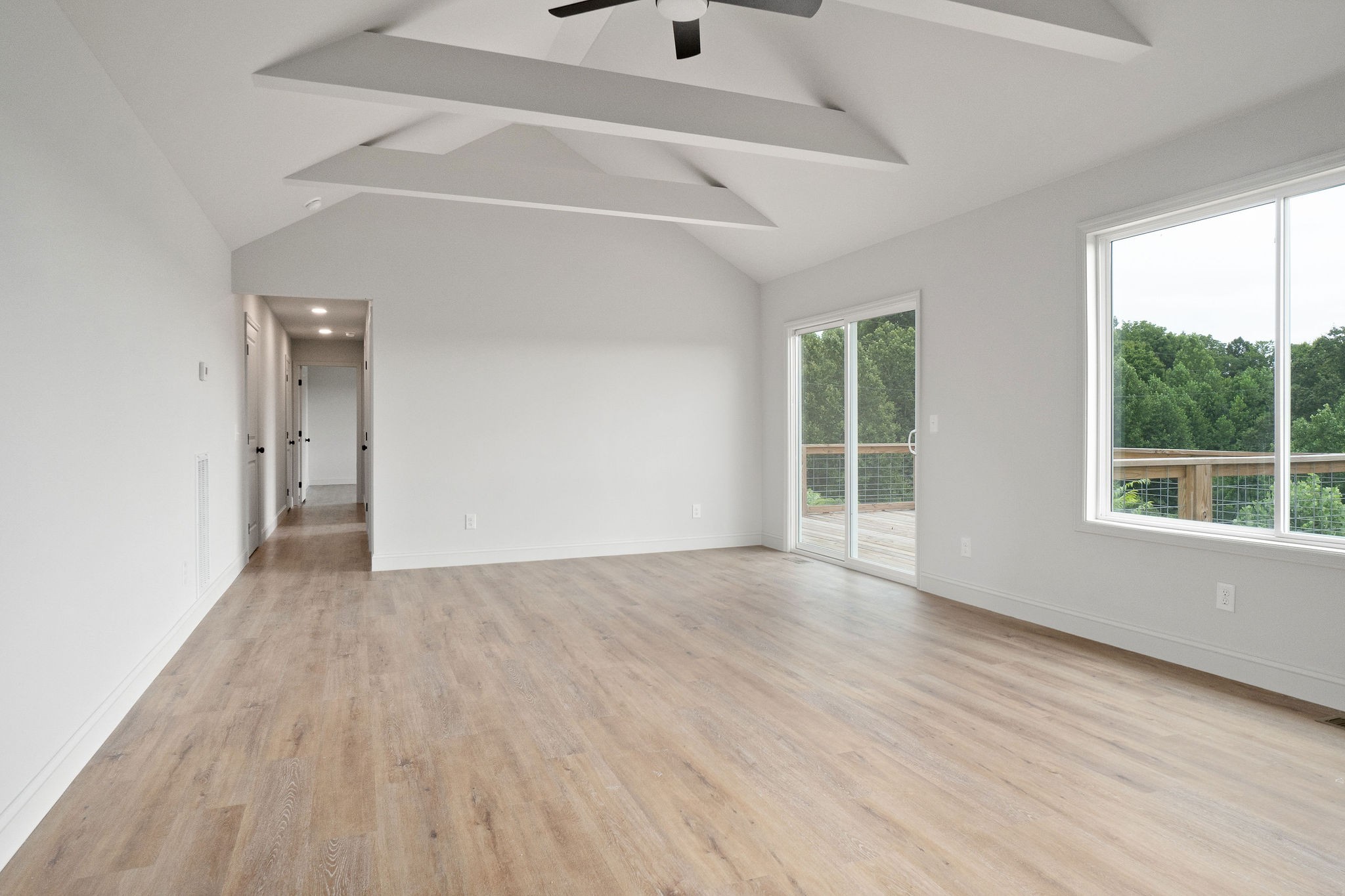 1124 Dale Ridge Road Dowelltown, TN 37059 - Photo 36 of 69 an empty room with wooden floor and windows