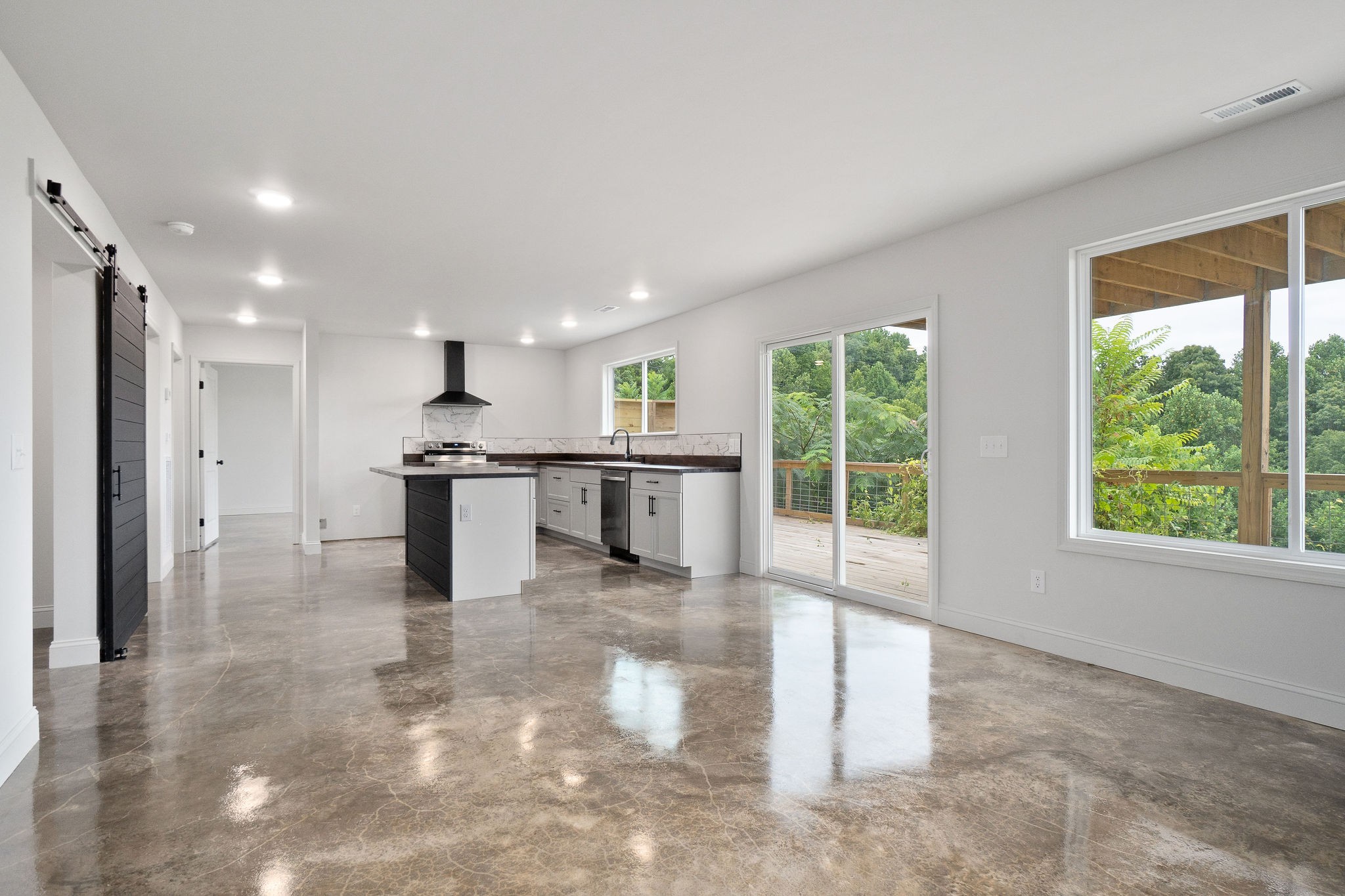 1124 Dale Ridge Road Dowelltown, TN 37059 - Photo 4 of 69 a view of a kitchen with kitchen island a large window cabinets a sink and stainless steel appliances