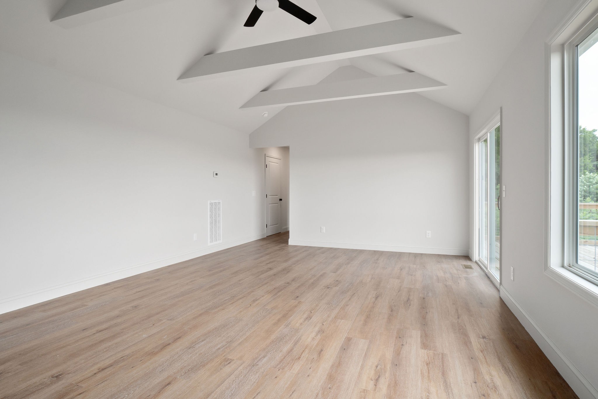 1124 Dale Ridge Road Dowelltown, TN 37059 - Photo 44 of 69 an empty room with wooden floor and windows