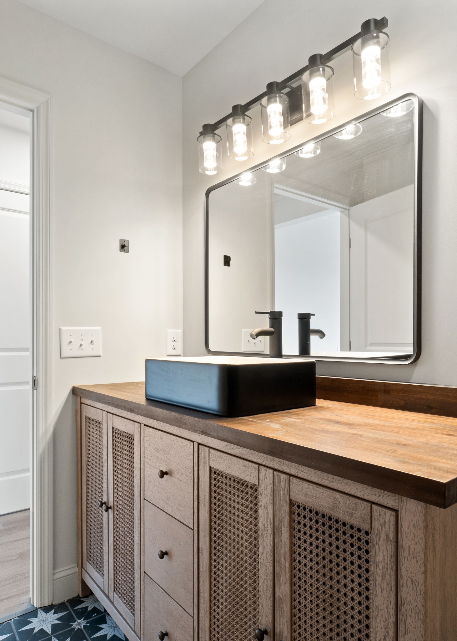 1124 Dale Ridge Road Dowelltown, TN 37059 - Photo 48 of 69 a bathroom with a double vanity sink and mirror