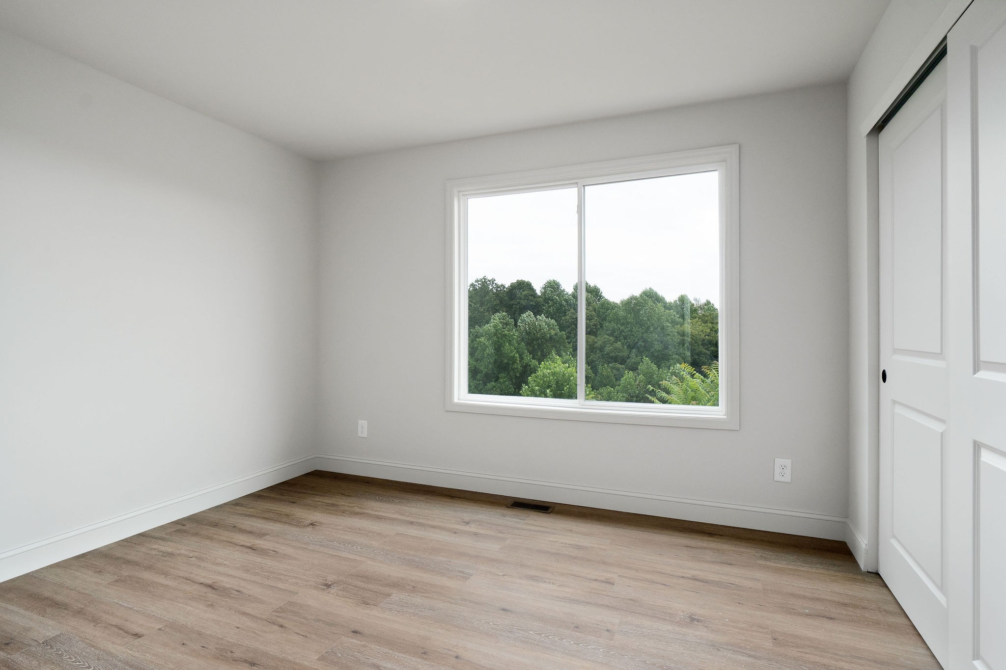 1124 Dale Ridge Road Dowelltown, TN 37059 - Photo 49 of 69 an empty room with wooden floor and windows