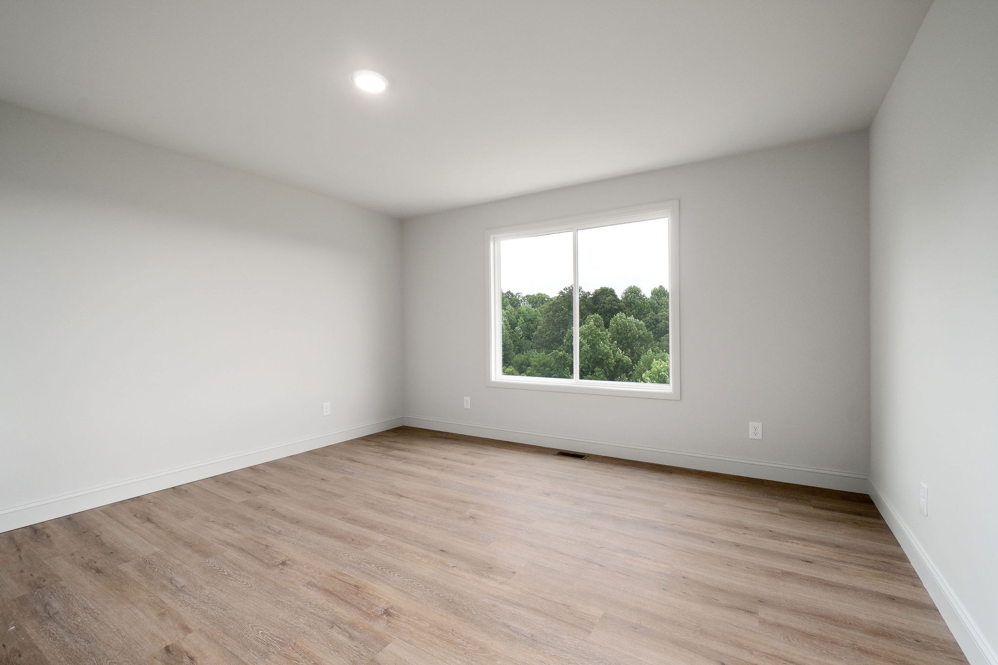1124 Dale Ridge Road Dowelltown, TN 37059 - Photo 50 of 69 an empty room with wooden floor and windows