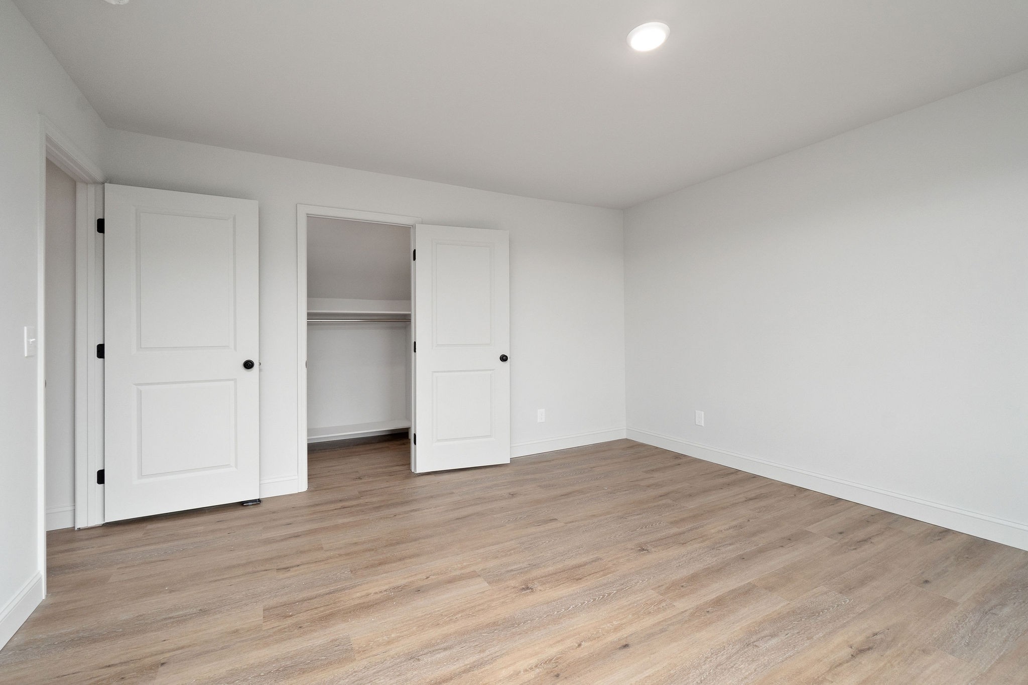1124 Dale Ridge Road Dowelltown, TN 37059 - Photo 51 of 69 a view of an empty room with wooden floor and closet