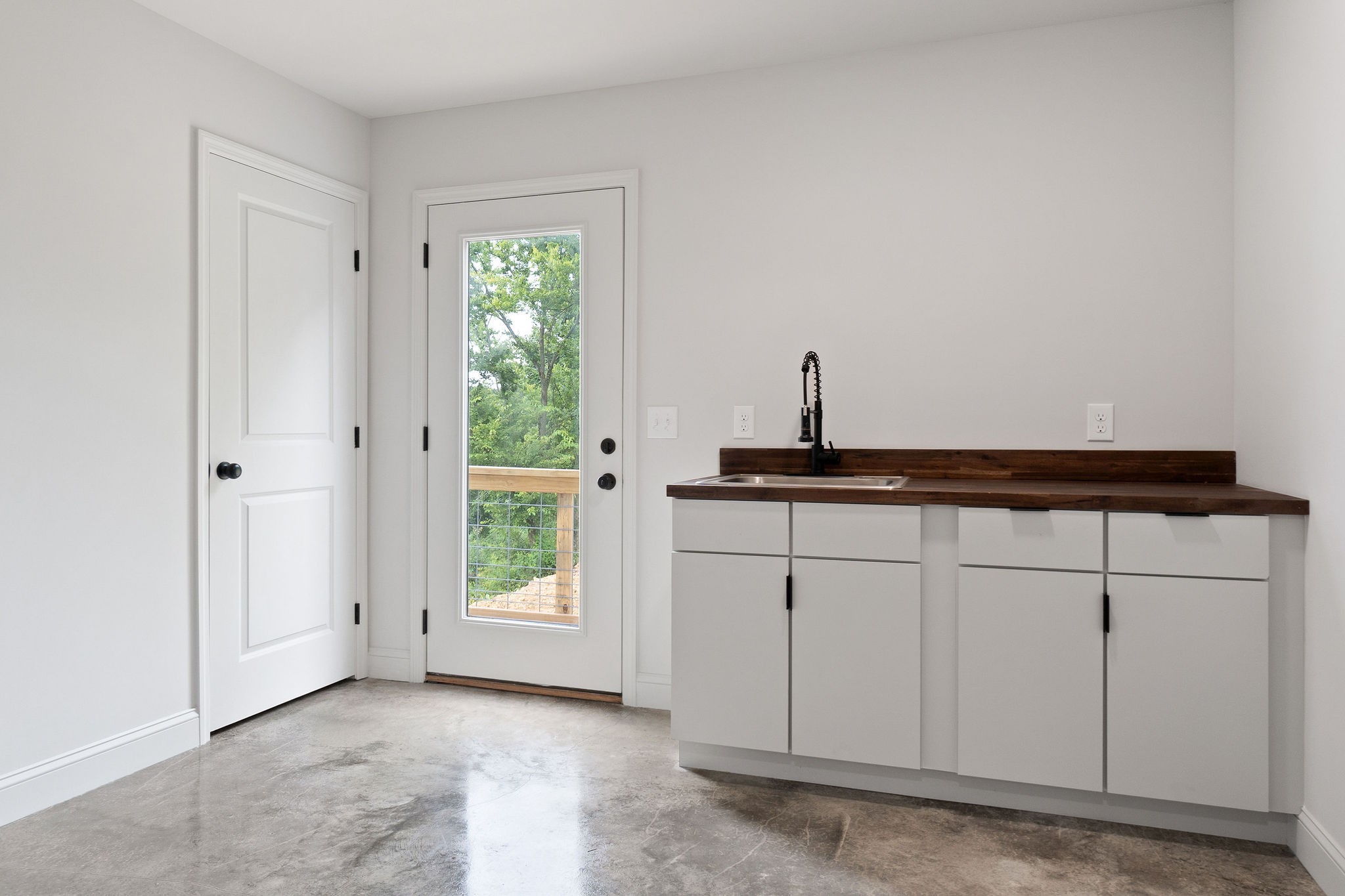 1124 Dale Ridge Road Dowelltown, TN 37059 - Photo 56 of 69 a kitchen with a white cabinets and a window