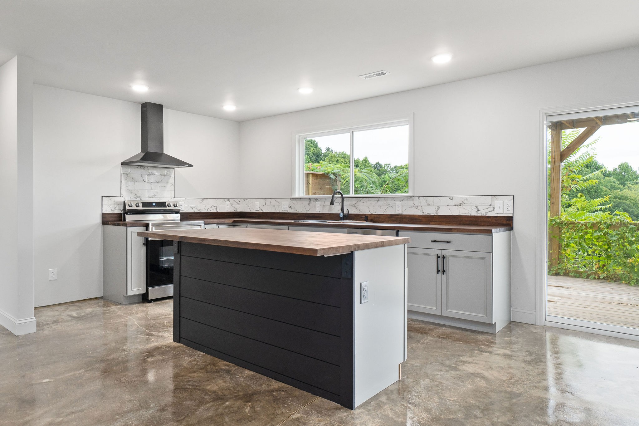 1124 Dale Ridge Road Dowelltown, TN 37059 - Photo 8 of 69 a kitchen with stainless steel appliances granite countertop a sink and a stove