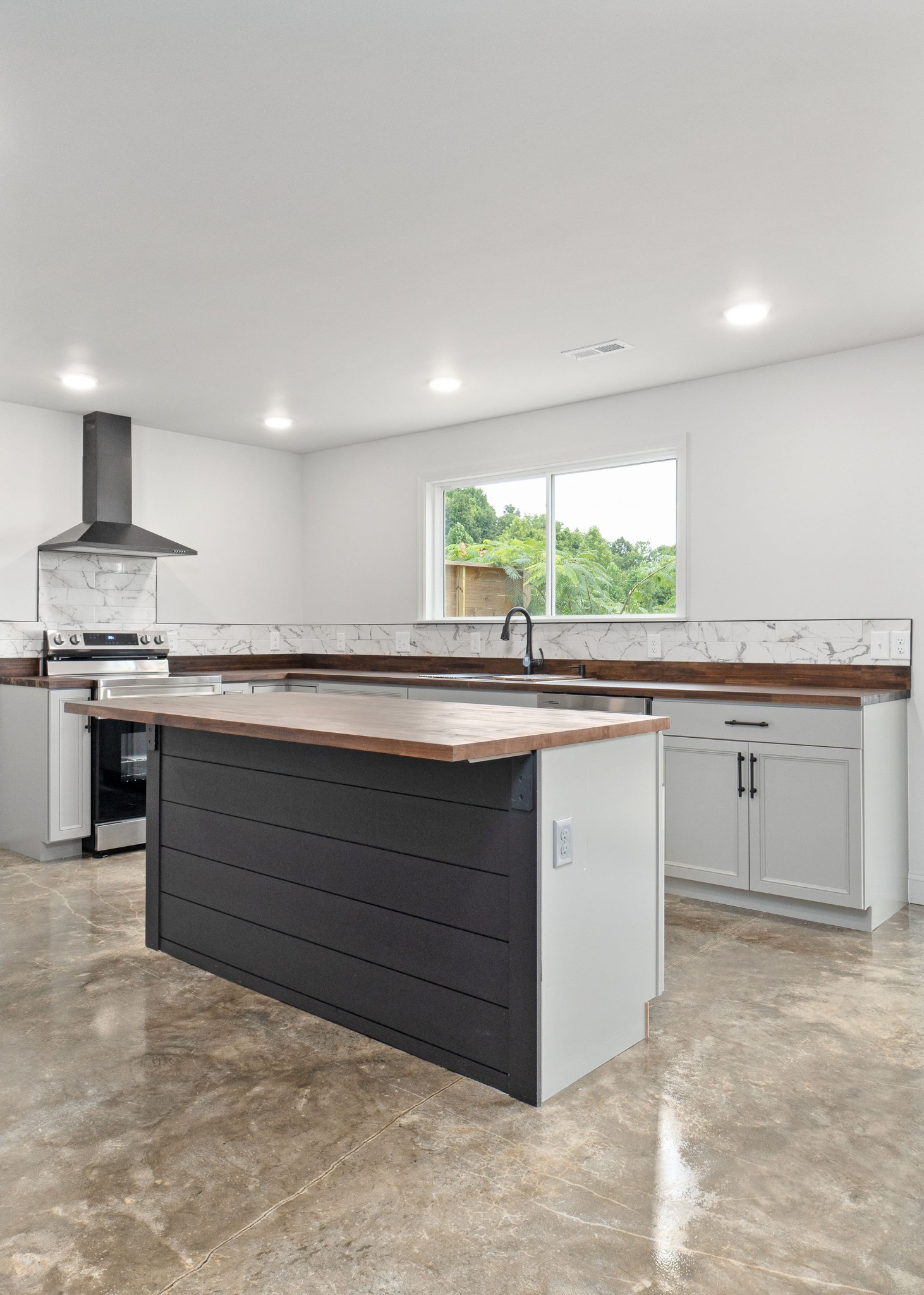 1124 Dale Ridge Road Dowelltown, TN 37059 - Photo 9 of 69 a kitchen with a sink stove and cabinets