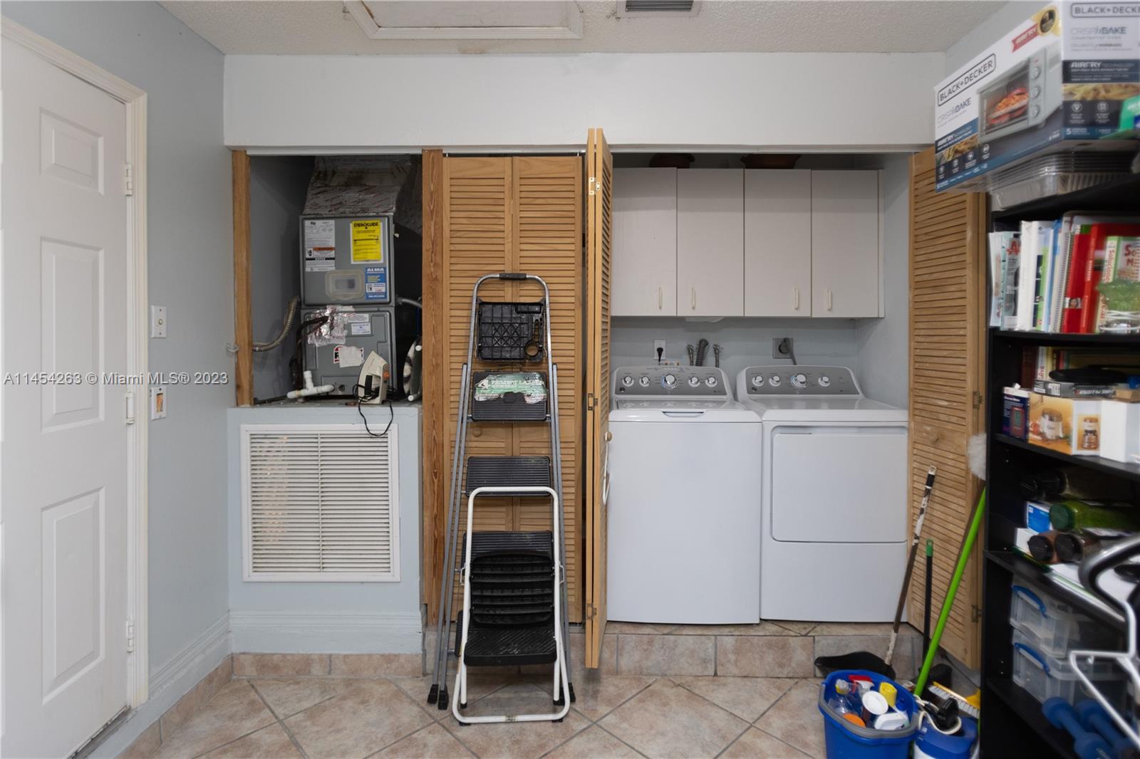 10067 Southwest 156th Avenue Miami, FL 33196 - Photo 14 of 21 a room with storage and utility