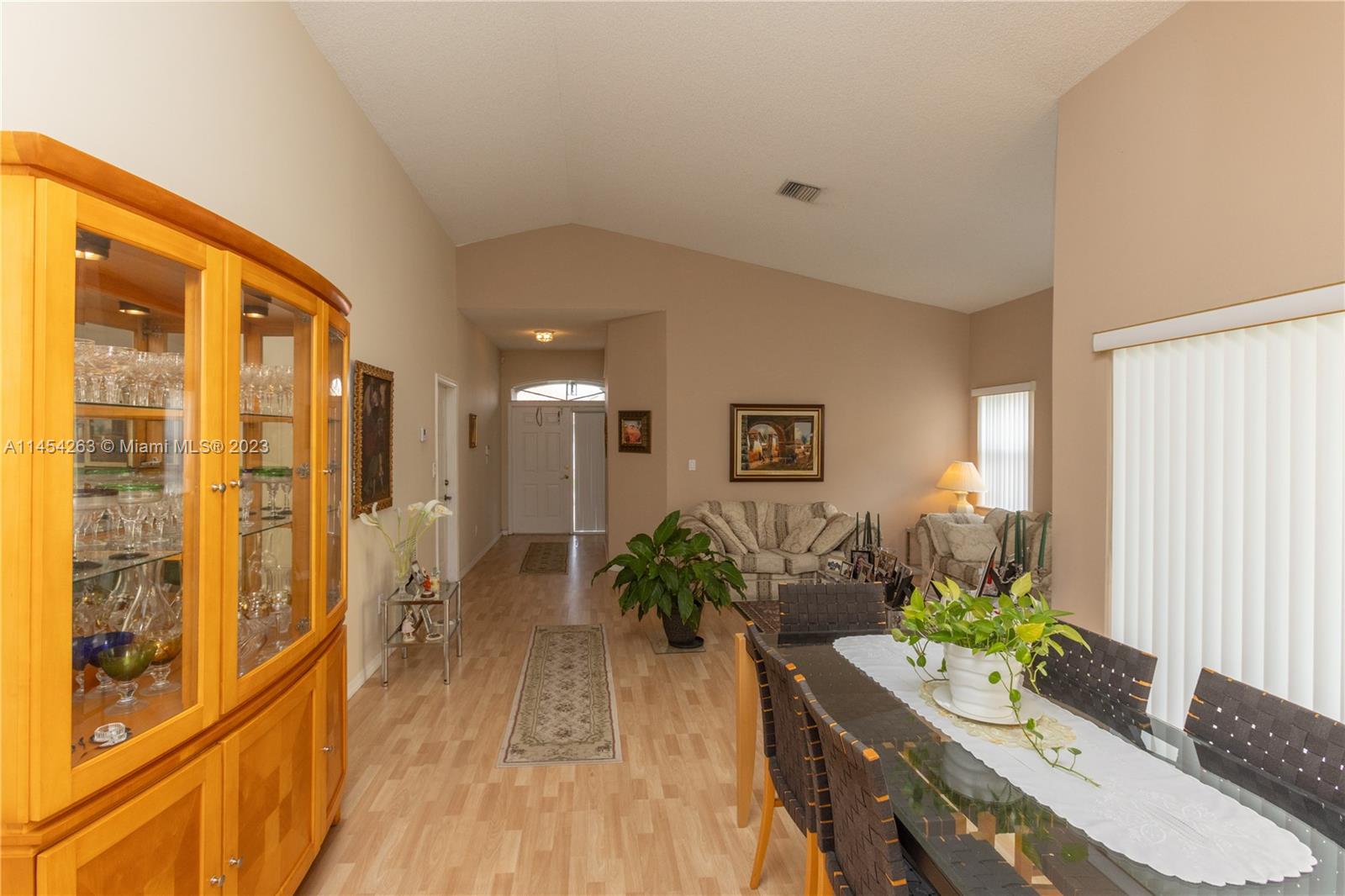 10067 Southwest 156th Avenue Miami, FL 33196 - Photo 16 of 21 a living room with furniture and a large window