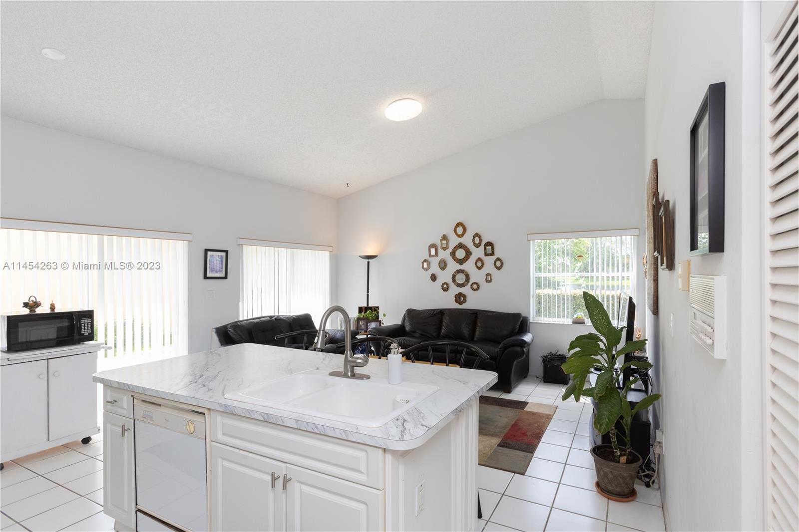 10067 Southwest 156th Avenue Miami, FL 33196 - Photo 3 of 21 a view of living room with furniture and a window