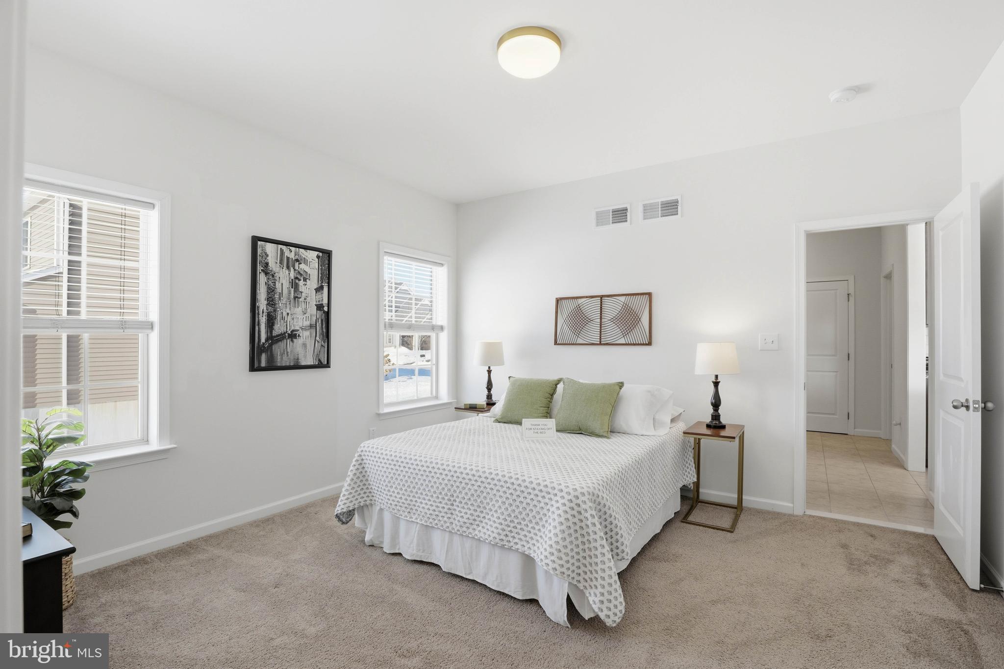 454 East Delp Road Lancaster, PA 17601 - Photo 27 of 78 a bedroom with a bed and a potted plant