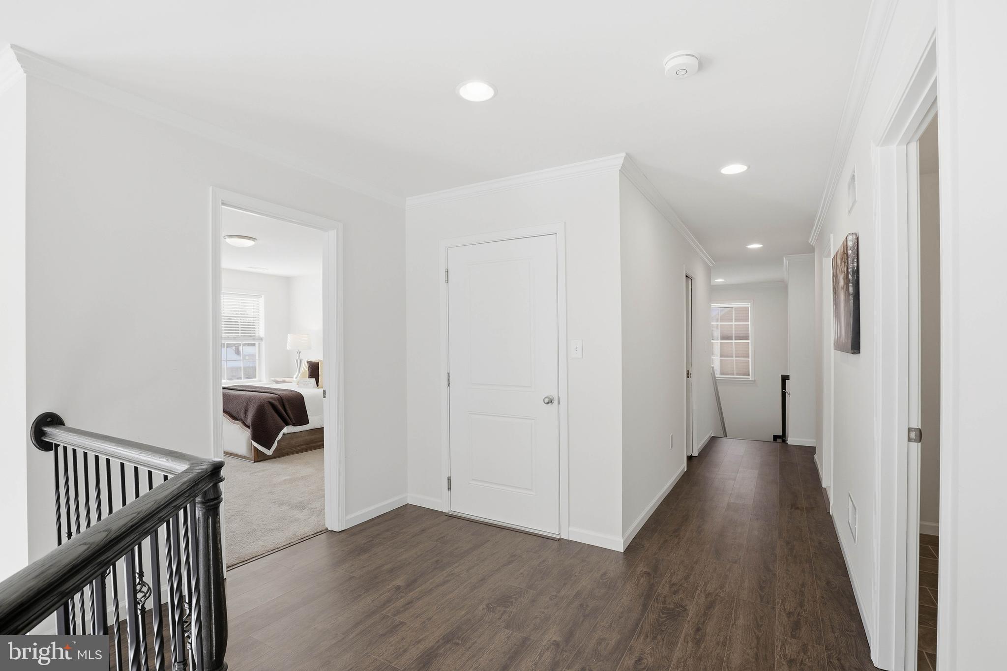 454 East Delp Road Lancaster, PA 17601 - Photo 37 of 78 a view of a hallway with wooden floor and a bathroom