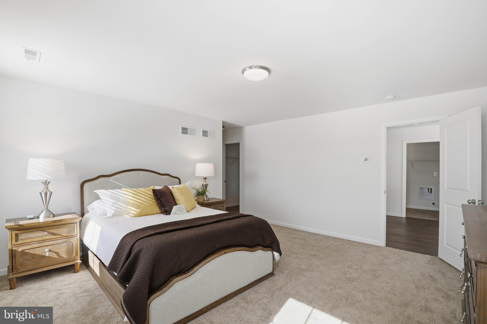 454 East Delp Road Lancaster, PA 17601 - Photo 39 of 78 a bedroom with a bed and painting on the wall