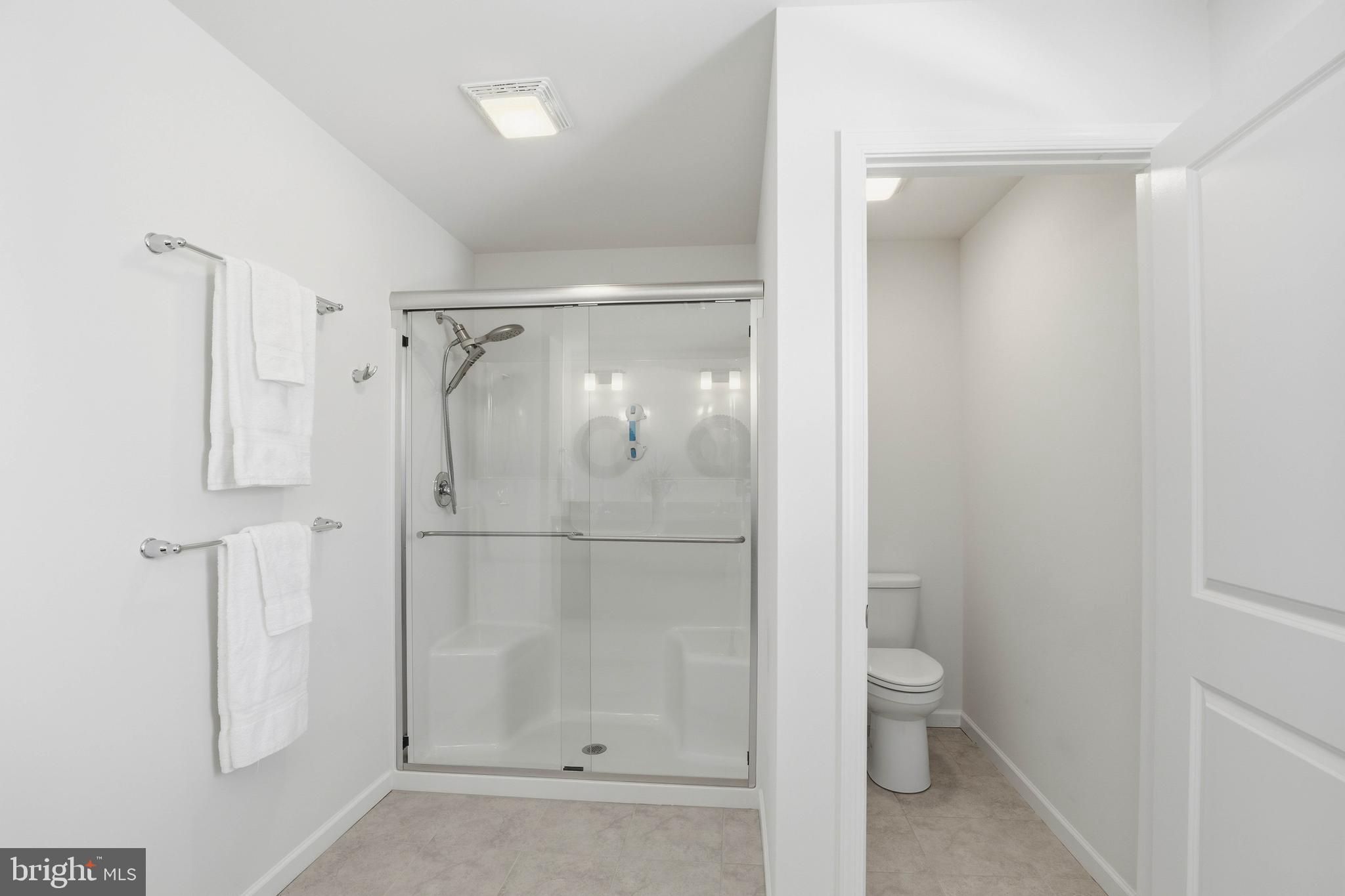 454 East Delp Road Lancaster, PA 17601 - Photo 43 of 78 a bathroom with a glass shower door