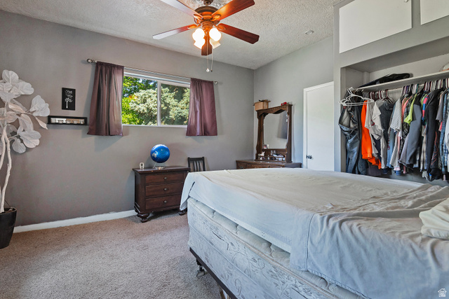 178 17th Street Ogden, UT 84404 - Photo 16 of 29 Carpeted room with a ceiling fan, a window, and a built-in closet with overhead storage