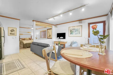 a living room with furniture and flat screen tv