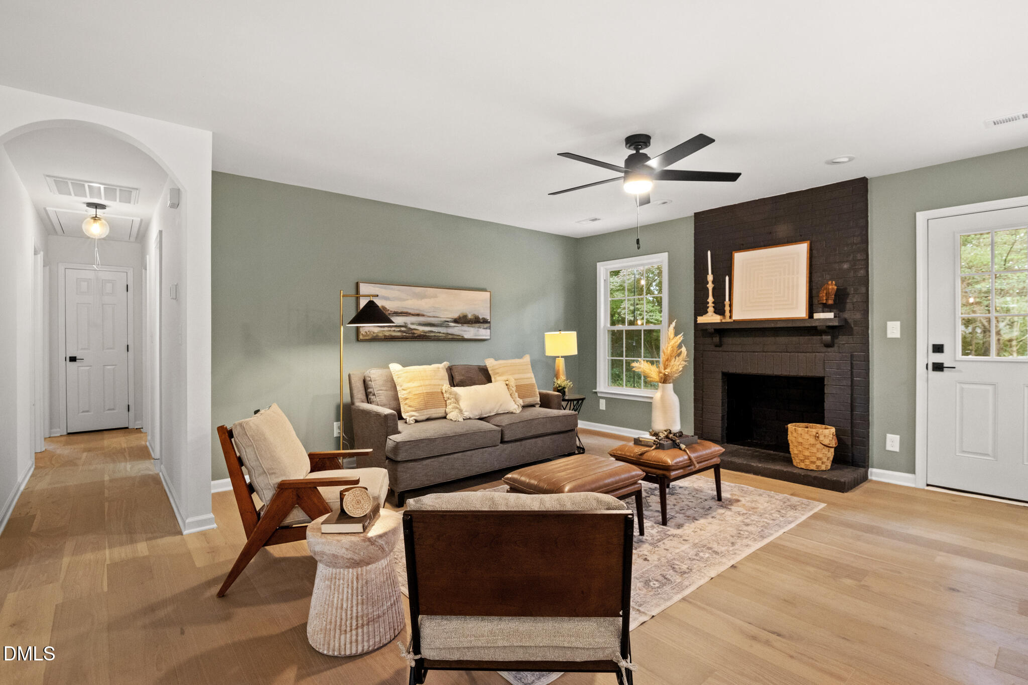 3509 Morningside Drive Raleigh, NC 27607 - Photo 6 of 49 a living room with furniture and a fireplace