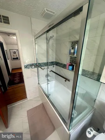 a view of a kitchen with a sink and a wooden floor