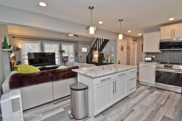 a kitchen with a stove and a sink