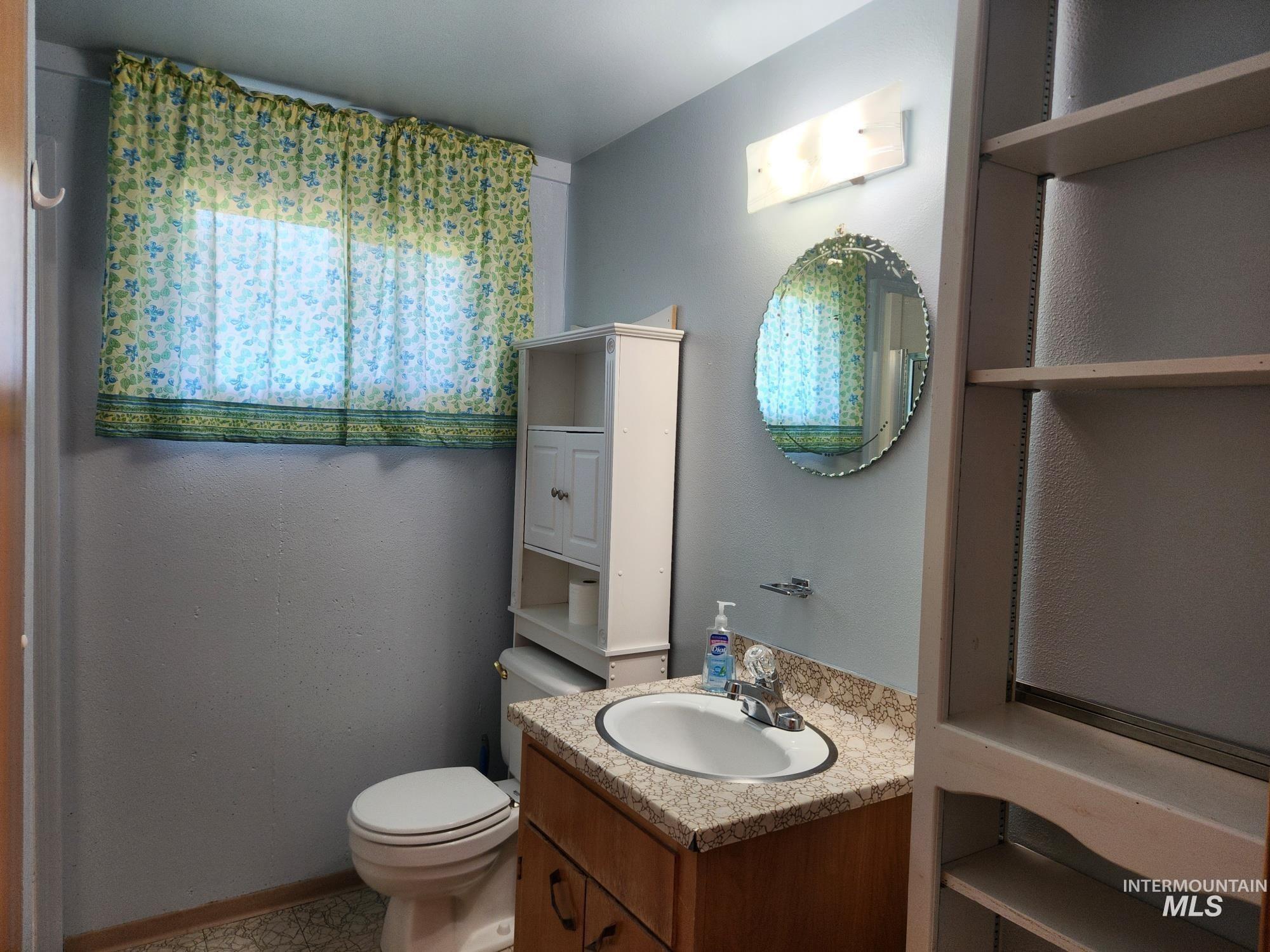 367 Woodland Road Kamiah, ID 83536 - Photo 25 of 49 Half bathroom featuring vanity and toilet