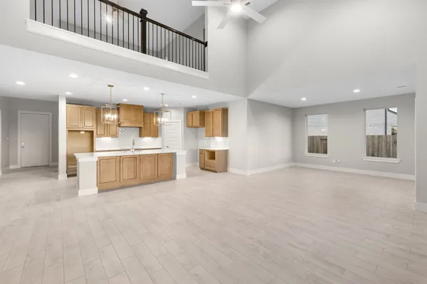 a view of a kitchen with a sink and cabinets