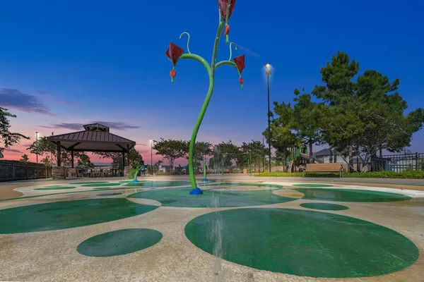 a view of a playground with basketball court
