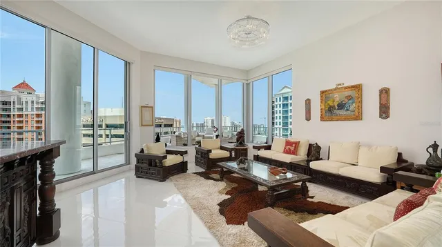 a living room with furniture or couch and a large window