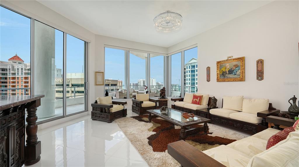 111 South Pineapple Avenue, Unit 1210 Sarasota, FL 34236 - Photo 17 of 54 a living room with furniture or couch and a large window