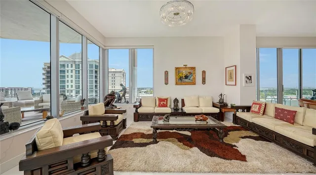 a living room with furniture or couch and a large window