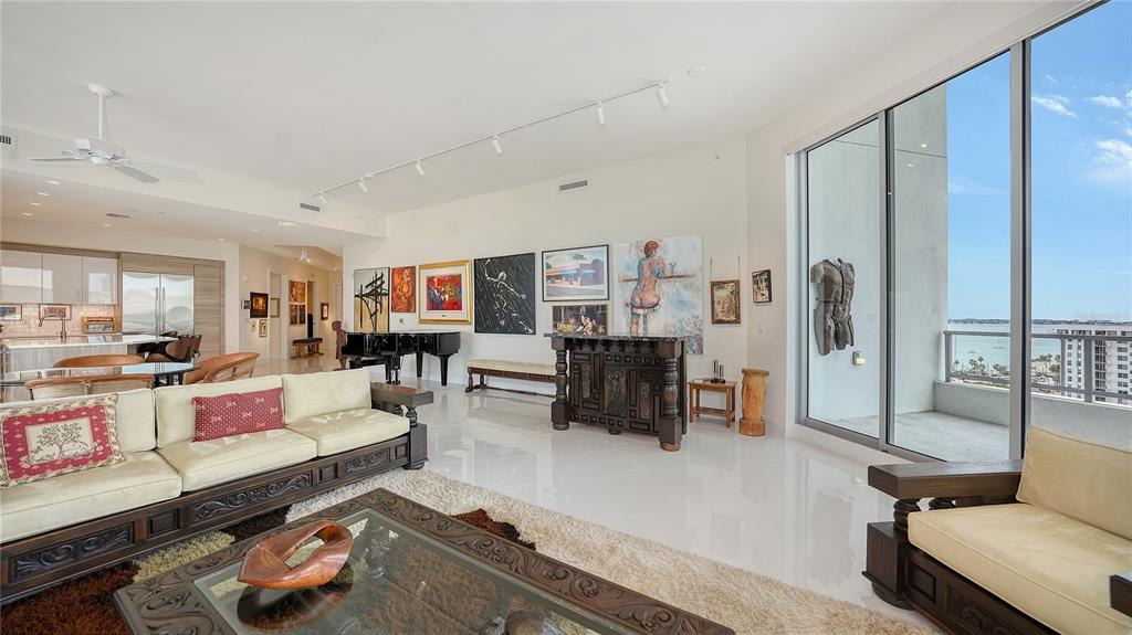 111 South Pineapple Avenue, Unit 1210 Sarasota, FL 34236 - Photo 20 of 54 a living room with furniture and a wooden floor