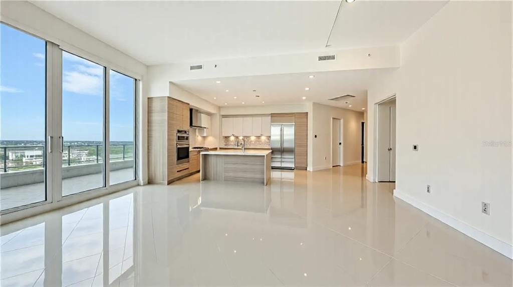 111 South Pineapple Avenue, Unit 1210 Sarasota, FL 34236 - Photo 22 of 54 a view of kitchen with furniture and refrigerator