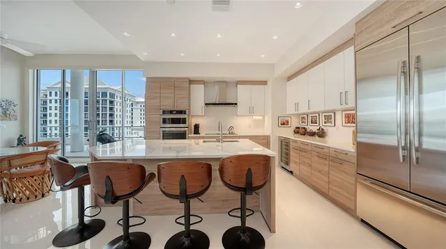 a kitchen with counter top space cabinets and stainless steel appliances