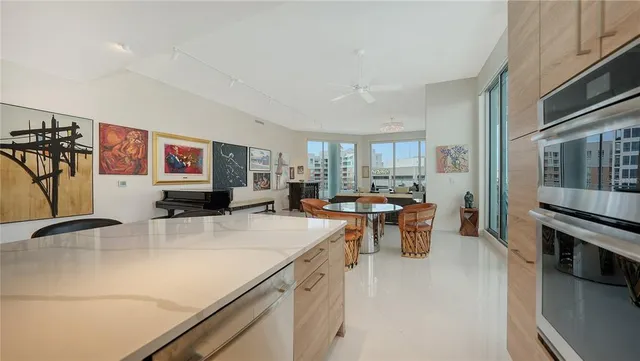 a kitchen with stainless steel appliances granite countertop a sink stove and cabinets