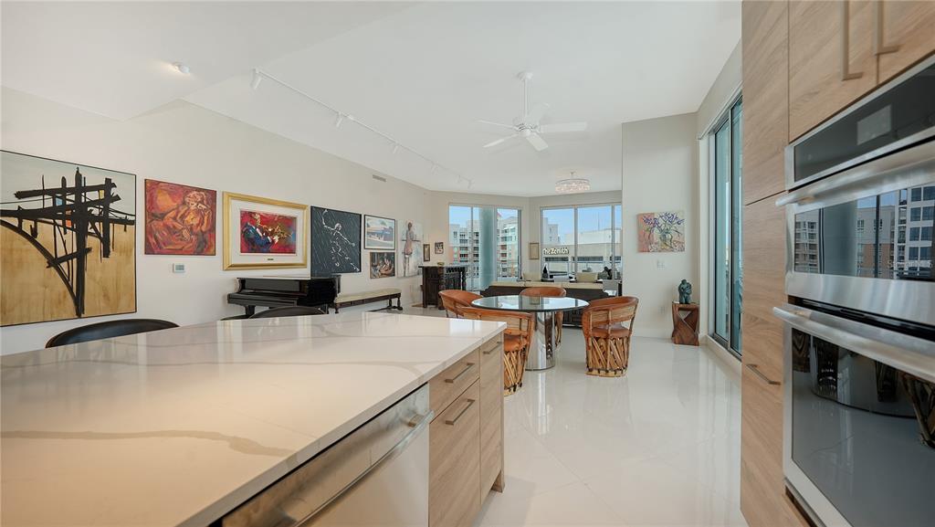 111 South Pineapple Avenue, Unit 1210 Sarasota, FL 34236 - Photo 34 of 54 a kitchen with stainless steel appliances granite countertop a sink stove and cabinets