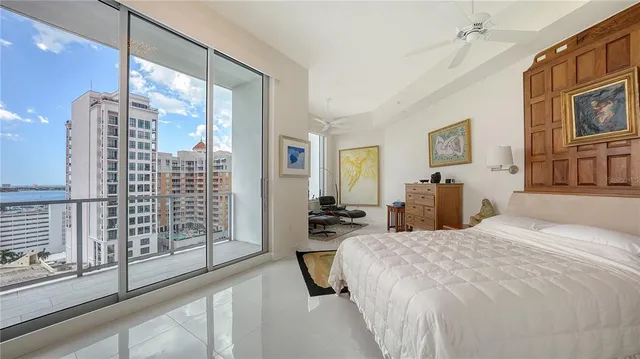 a bedroom with a bed next to a window with the outer view
