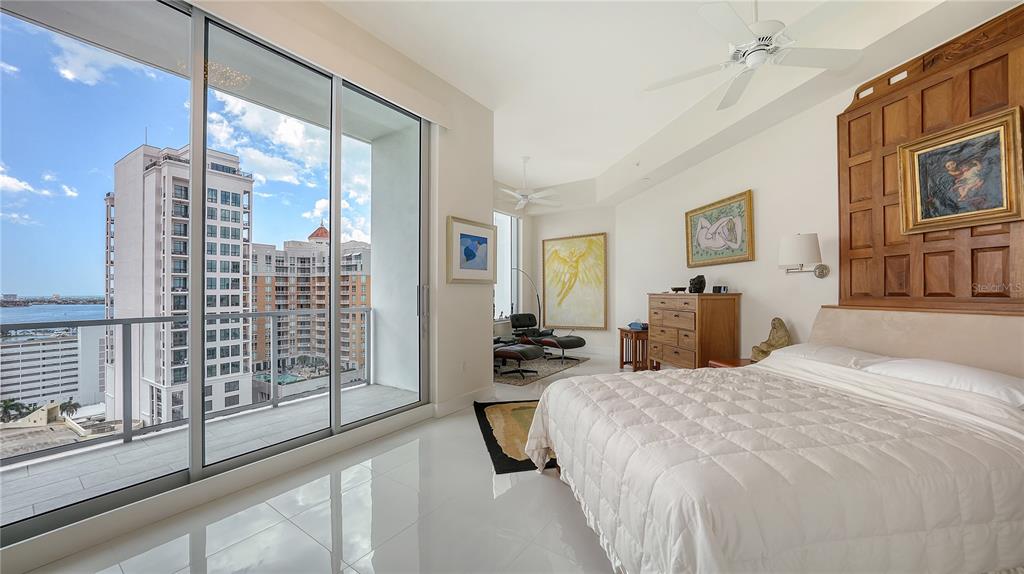 111 South Pineapple Avenue, Unit 1210 Sarasota, FL 34236 - Photo 38 of 54 a bedroom with a bed next to a window with the outer view