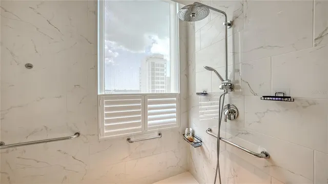 a bathroom with a granite countertop sink a toilet and bathtub