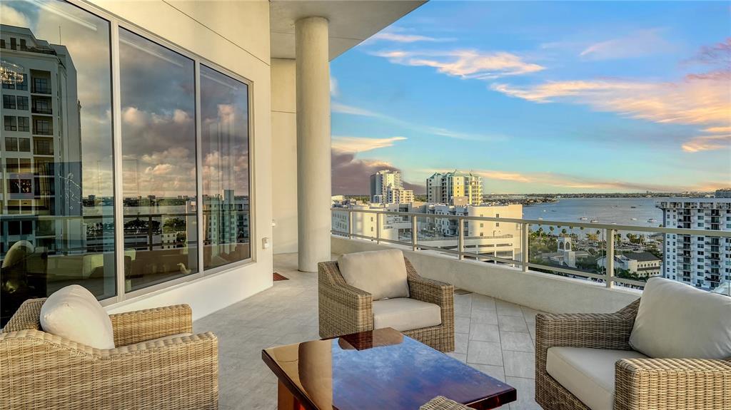 111 South Pineapple Avenue, Unit 1210 Sarasota, FL 34236 - Photo 47 of 54 a balcony with furniture and a potted plant