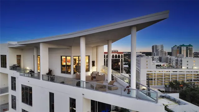 a view of a living room and balcony