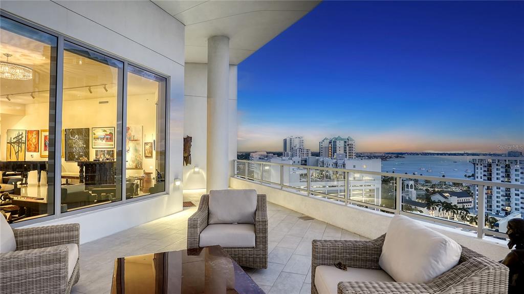 111 South Pineapple Avenue, Unit 1210 Sarasota, FL 34236 - Photo 10 of 54 a living room with furniture and a large window