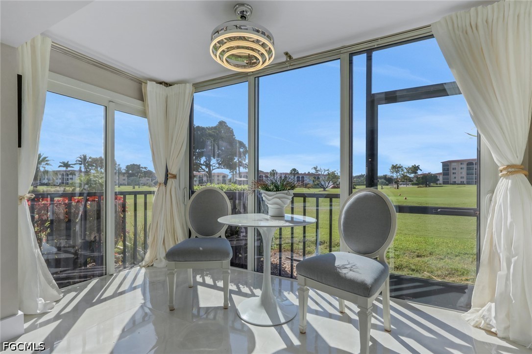 9 High Point Circle North, Unit 101 Naples, FL 34103 - Photo 11 of 49 a view of a dining room with furniture window and outside view