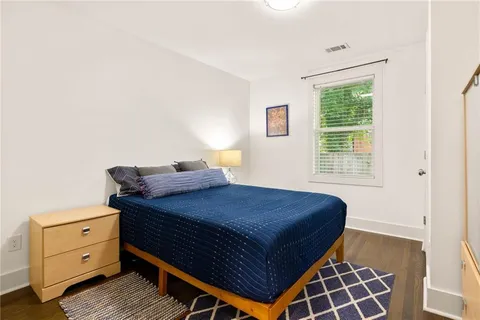 a bedroom with a bed and window