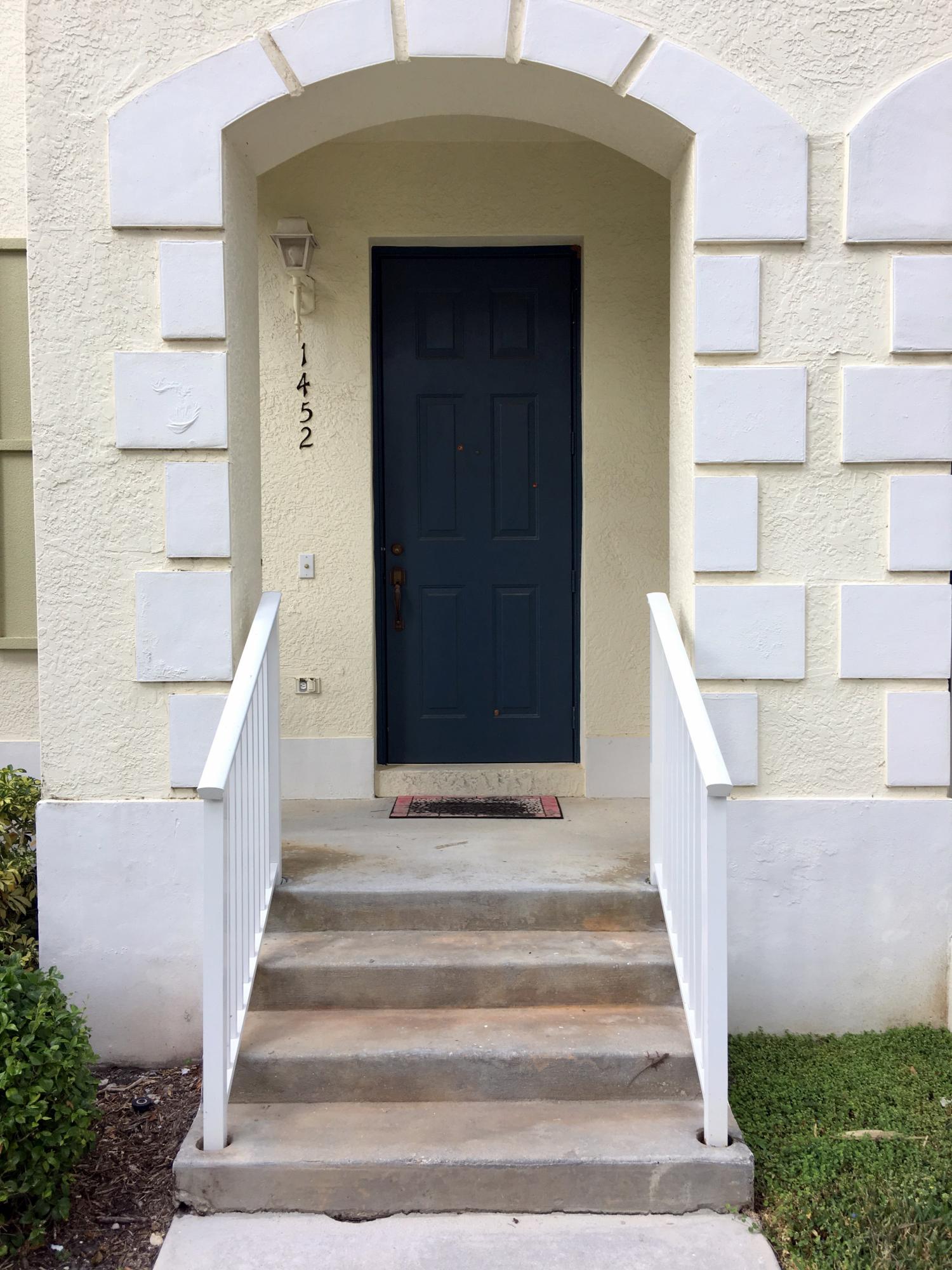 1452 Cupcoy Avenue Jupiter, FL 33458 - Photo 1 of 20 Front of TH via Courtyard