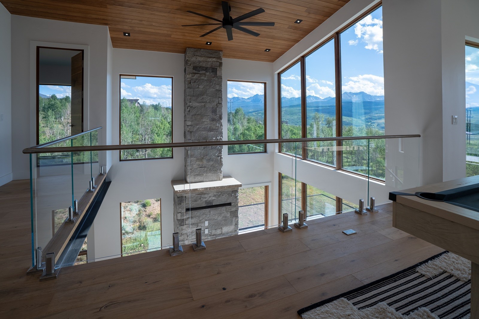 2150 Elk Run Road Silverthorne, CO 80498 - Photo 14 of 29 Loft with view of living area and natural lighting.