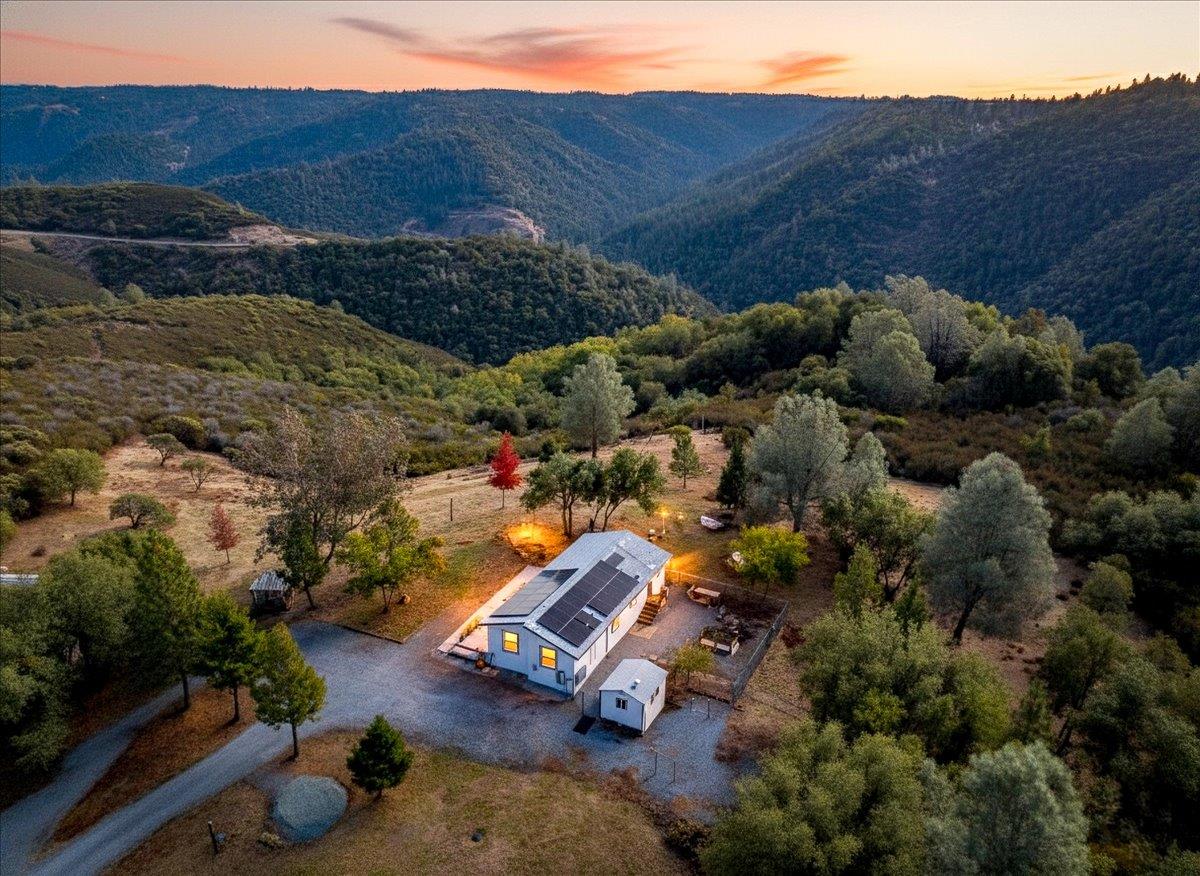 a view of a street with a mountain