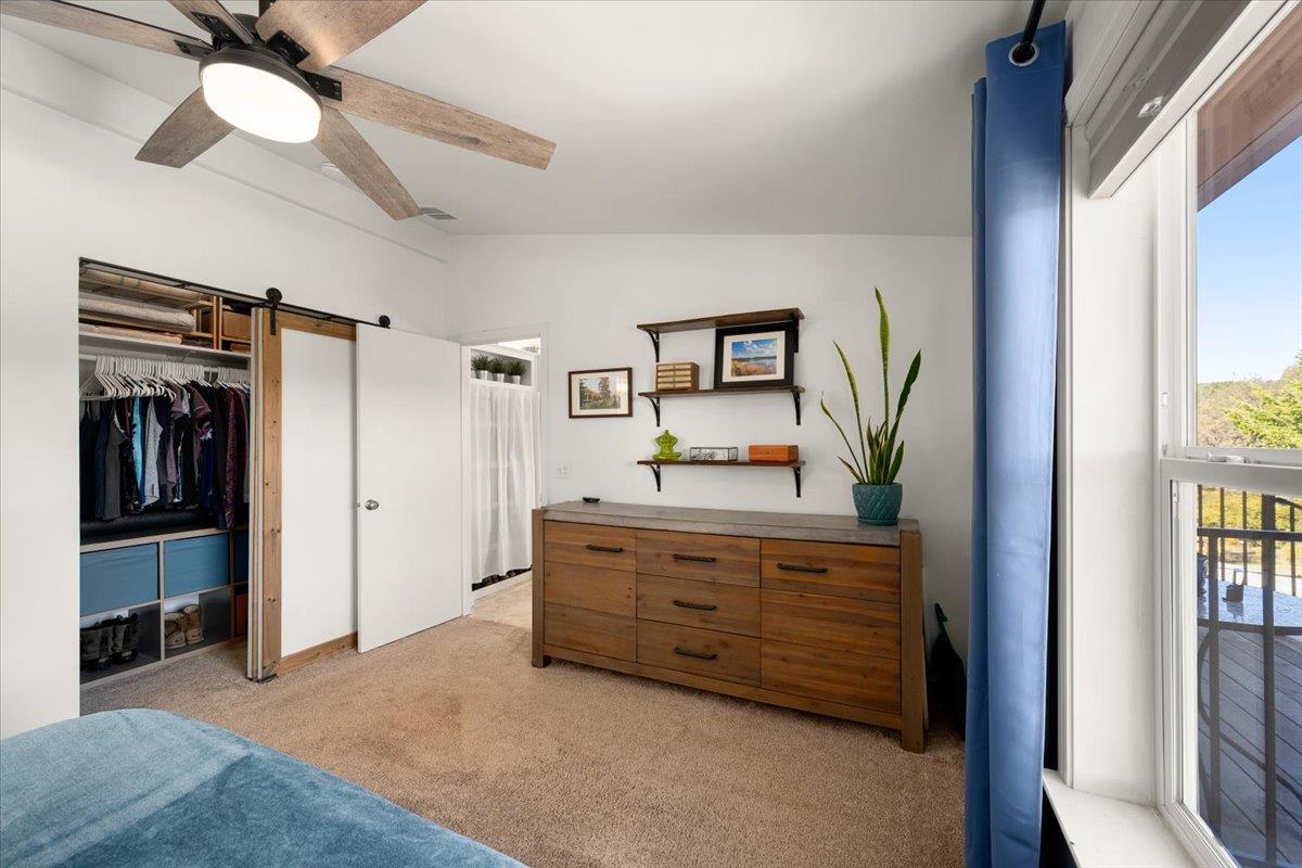 7155 Stewart Mine Road Placerville, CA 95667 - Photo 19 of 68 a room with a bed and a television