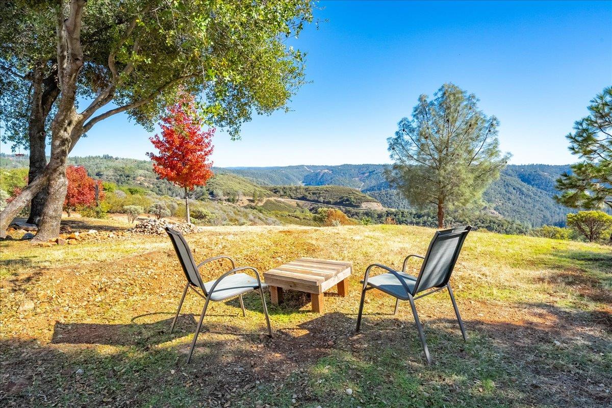 7155 Stewart Mine Road Placerville, CA 95667 - Photo 2 of 68 a view of a chairs and table on the terrace