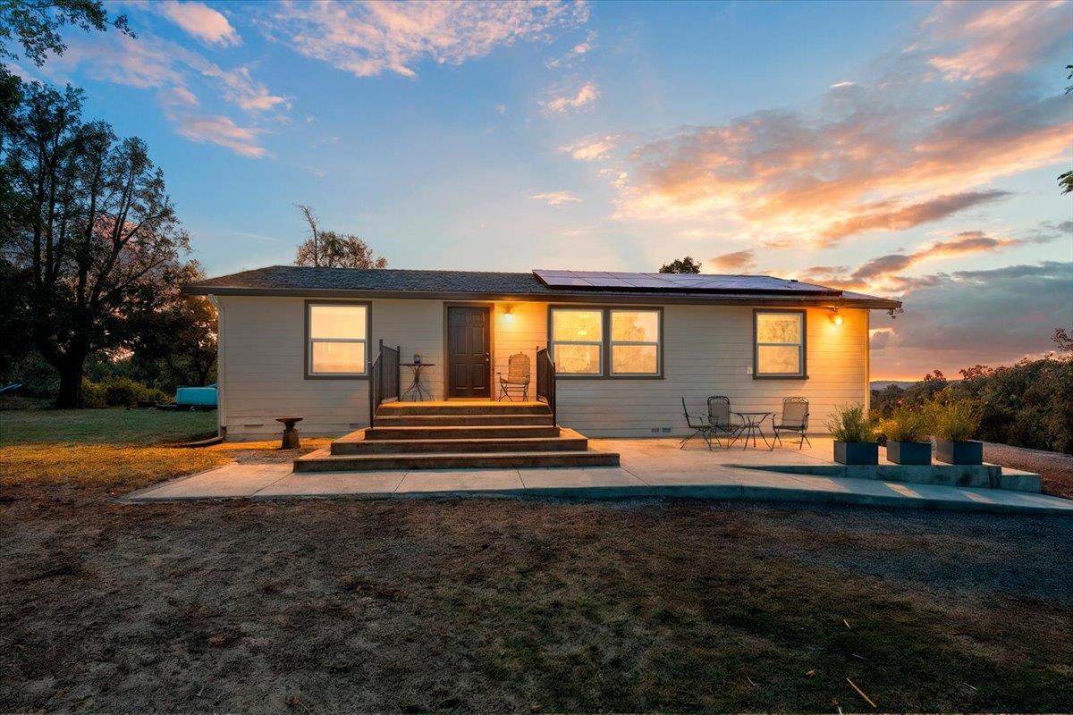 7155 Stewart Mine Road Placerville, CA 95667 - Photo 3 of 68 a view of a house with backyard and sitting area