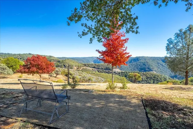 a view of outdoor space with playground and green space