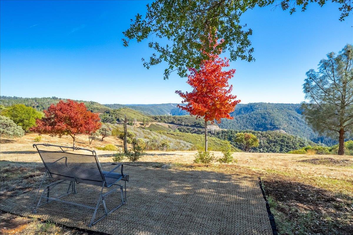 7155 Stewart Mine Road Placerville, CA 95667 - Photo 31 of 68 a view of a swimming pool with an outdoor seating